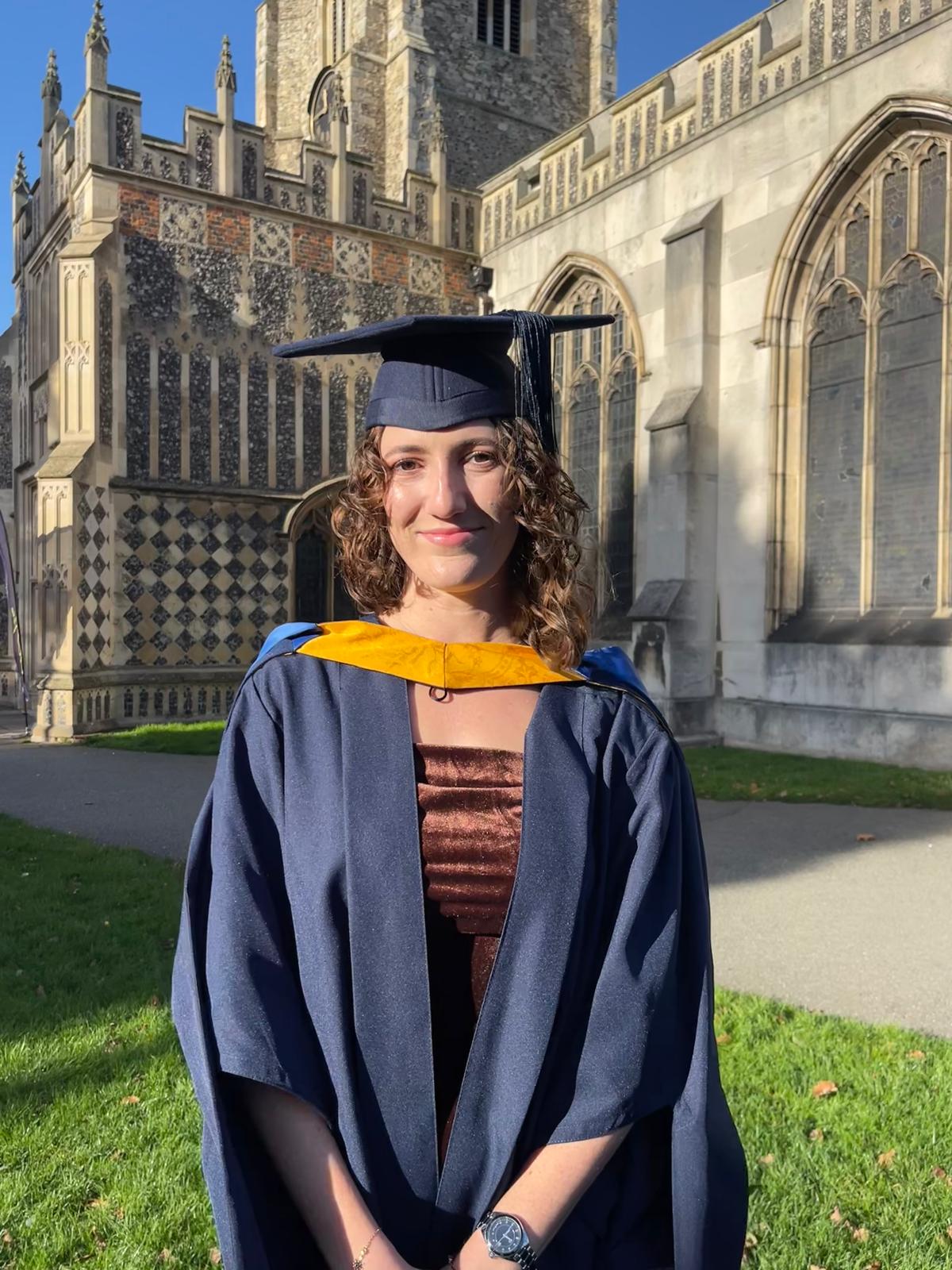 Amber McMillan in graduation gown after her Integrated Masters in Veterinary Physiotherapy